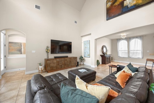 106 Tonkawa Trl W, Austin, TX 78738 - living area featuring light tile patterned flooring, high vaulted ceiling, and arched walkways