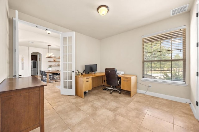 106 Tonkawa Trl W, Austin, TX 78738 - office space featuring arched walkways, french doors, light tile patterned floors, and a chandelier