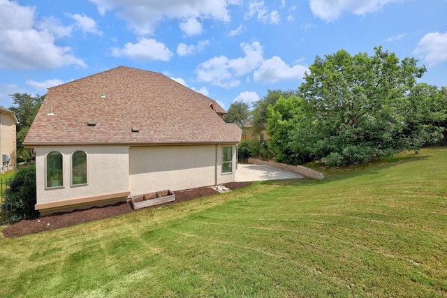 106 Tonkawa Trl W, Austin, TX 78738 - view of side of home with a yard, a patio, and stucco siding