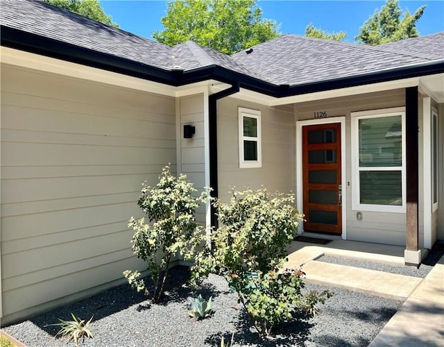 1126 Linden St Unit 2, Austin, TX 78702 - view of exterior entry with roof with shingles