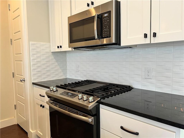 1126 Linden St Unit 2, Austin, TX 78702 - kitchen featuring stainless steel appliances, dark countertops, white cabinetry, and backsplash