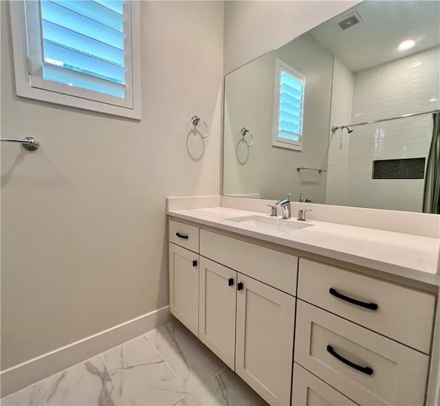 1126 Linden St Unit 2, Austin, TX 78702 - bathroom with marble look tile flooring, tiled shower, and vanity