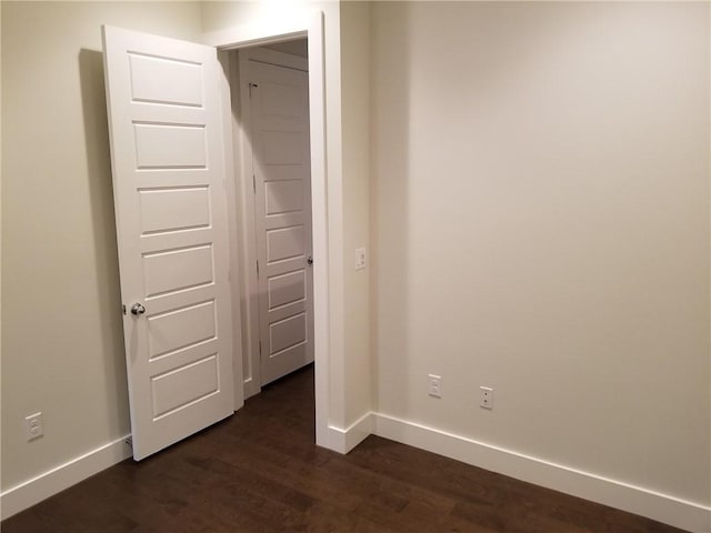 1126 Linden St Unit 2, Austin, TX 78702 - unfurnished bedroom with baseboards and dark wood-type flooring