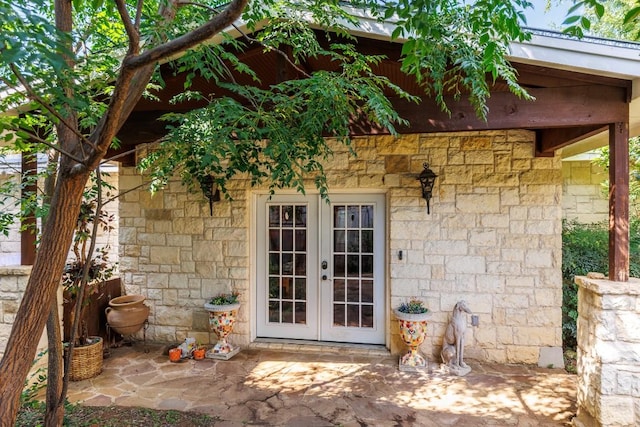 4842 W Fm 2147, Horseshoe Bay, TX 78657 - entrance to property with french doors, stone siding, and a patio