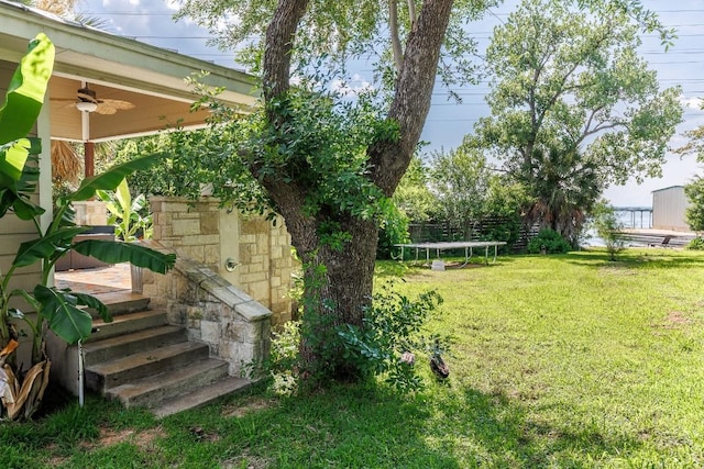4842 W Fm 2147, Horseshoe Bay, TX 78657 - view of green lawn featuring a trampoline and ceiling fan