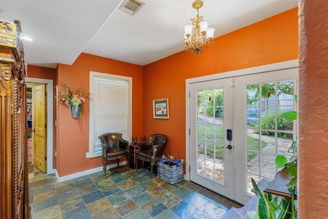4842 W Fm 2147, Horseshoe Bay, TX 78657 - doorway featuring dark stone finish flooring and a chandelier