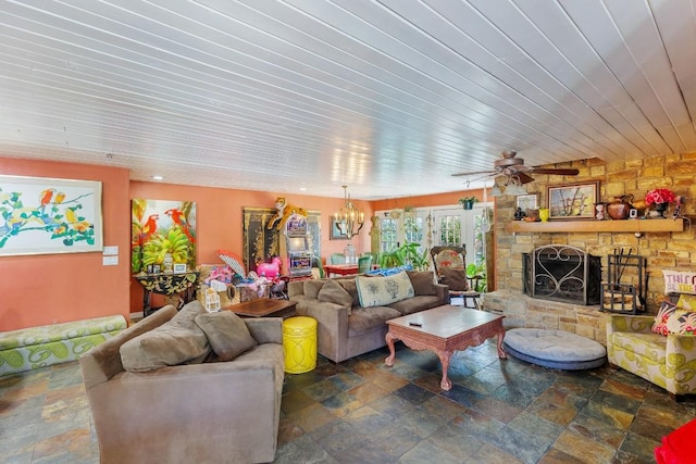 4842 W Fm 2147, Horseshoe Bay, TX 78657 - living room with stone tile flooring, a fireplace, wood ceiling, a chandelier, and ceiling fan