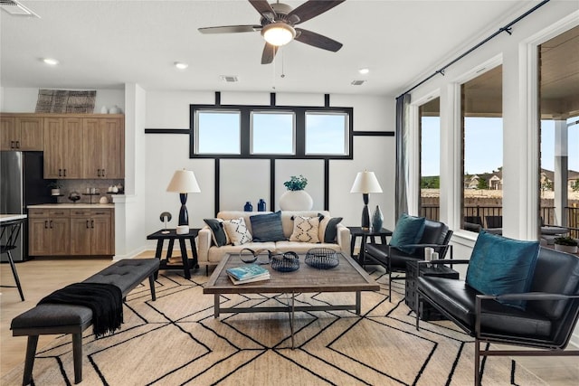 19512 Erna Dr, Pflugerville, TX 78660 - living area featuring a ceiling fan, recessed lighting, and light wood-style floors