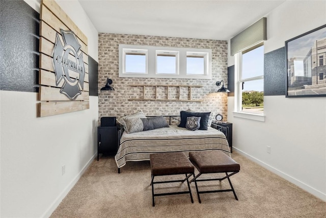 19512 Erna Dr, Pflugerville, TX 78660 - carpeted bedroom with baseboards and brick wall