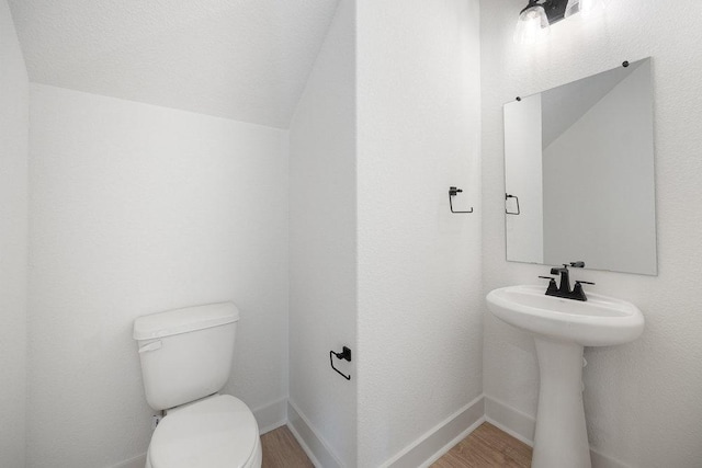 1601 Cardinal Ln, Round Rock, TX 78681 - bathroom with wood finished floors and vaulted ceiling