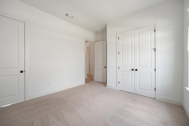 1601 Cardinal Ln, Round Rock, TX 78681 - unfurnished bedroom with carpet floors and a closet