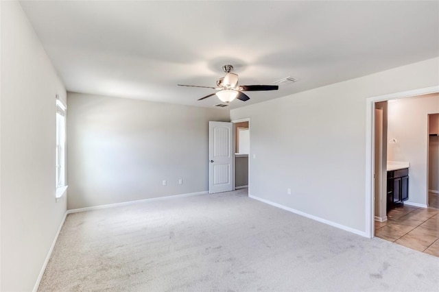 1710 Atlantica St, Cedar Park, TX 78613 - unfurnished bedroom featuring light colored carpet, ceiling fan, and connected bathroom