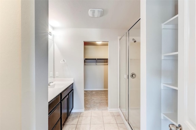 1710 Atlantica St, Cedar Park, TX 78613 - full bathroom with a spacious closet, vanity, a stall shower, and tile patterned flooring