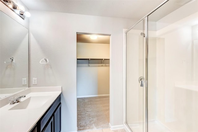1710 Atlantica St, Cedar Park, TX 78613 - bathroom with a shower stall, vanity, and a spacious closet