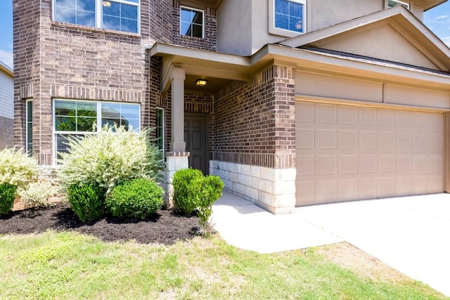 1710 Atlantica St, Cedar Park, TX 78613 - entrance to property featuring stucco siding, a garage, and brick siding
