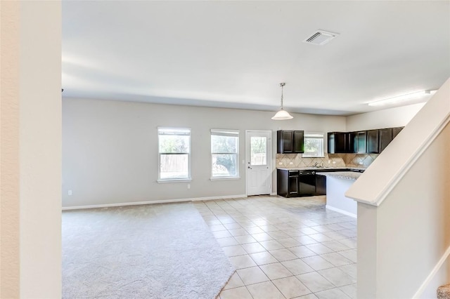 1710 Atlantica St, Cedar Park, TX 78613 - unfurnished living room featuring light tile patterned flooring and baseboards