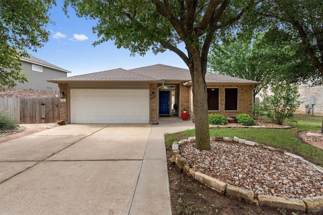 914 Flanagan Dr, Leander, TX 78641 - ranch-style home with driveway, an attached garage, and brick siding