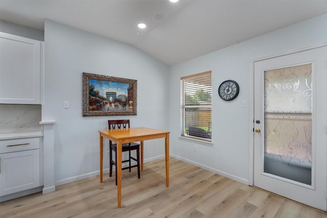 914 Flanagan Dr, Leander, TX 78641 - dining area featuring light wood finished floors, lofted ceiling, and recessed lighting
