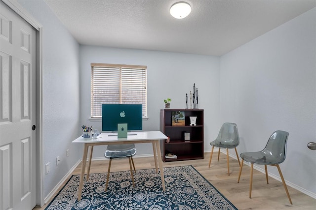 914 Flanagan Dr, Leander, TX 78641 - office area featuring wood finished floors and a textured ceiling