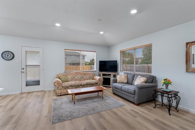914 Flanagan Dr, Leander, TX 78641 - living area featuring wood finished floors, lofted ceiling, and recessed lighting
