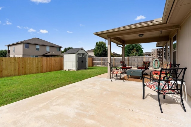 914 Flanagan Dr, Leander, TX 78641 - fenced backyard with a patio and a storage unit