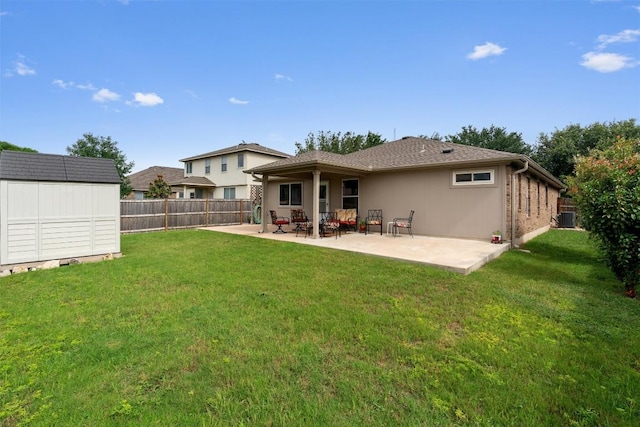 914 Flanagan Dr, Leander, TX 78641 - back of property with a patio, a storage unit, and a fenced backyard