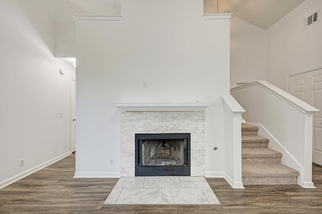216 Cassandra Dr, Hutto, TX 78634 - detailed view of wood finished floors and a fireplace with flush hearth