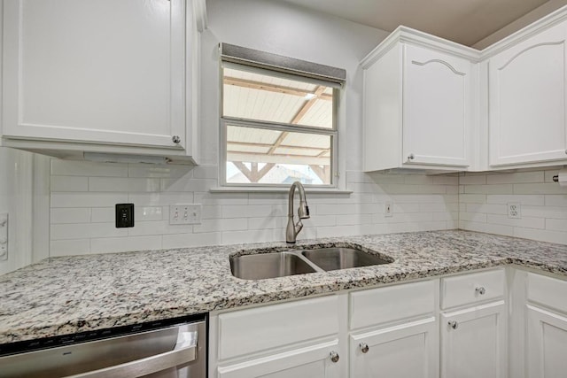216 Cassandra Dr, Hutto, TX 78634 - kitchen featuring dishwasher, white cabinetry, and backsplash