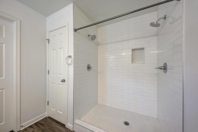 216 Cassandra Dr, Hutto, TX 78634 - full bathroom with a tile shower and wood finished floors