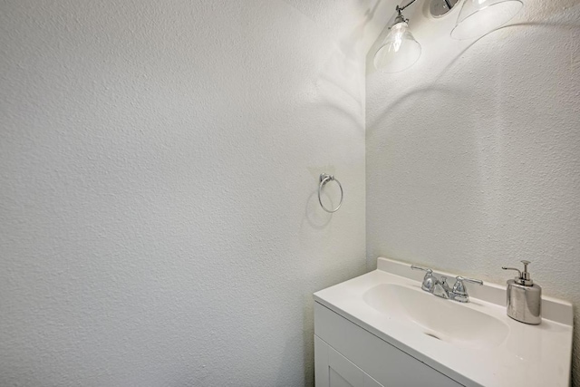 216 Cassandra Dr, Hutto, TX 78634 - bathroom with vanity and a textured wall