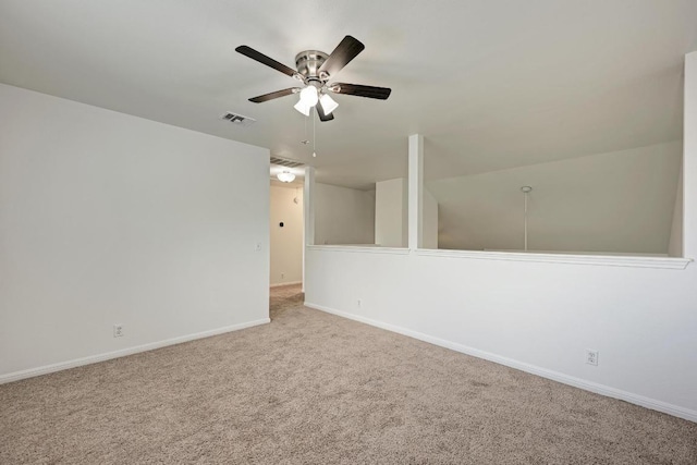 216 Cassandra Dr, Hutto, TX 78634 - spare room featuring carpet flooring, a ceiling fan, and attic access