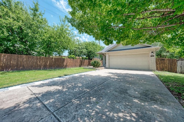 216 Cassandra Dr, Hutto, TX 78634 - garage with concrete driveway