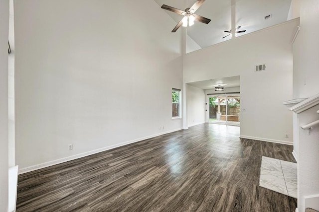 216 Cassandra Dr, Hutto, TX 78634 - unfurnished living room with dark wood-type flooring, a ceiling fan, and high vaulted ceiling