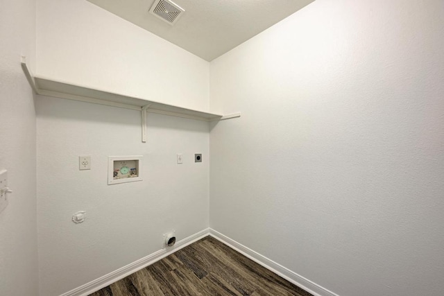 216 Cassandra Dr, Hutto, TX 78634 - laundry room with hookup for a washing machine, dark wood-type flooring, electric dryer hookup, and gas dryer hookup
