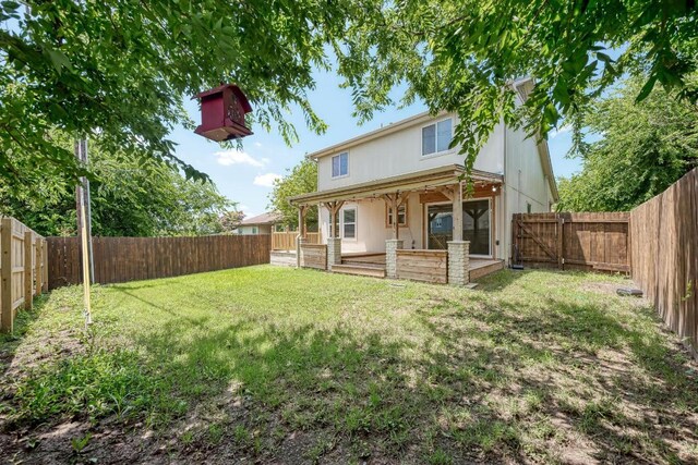 216 Cassandra Dr, Hutto, TX 78634 - rear view of property with a fenced backyard