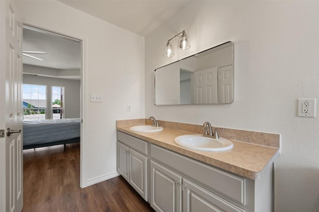 104 Live Oak Cir, Bertram, TX 78605 - full bath with double vanity and wood finished floors