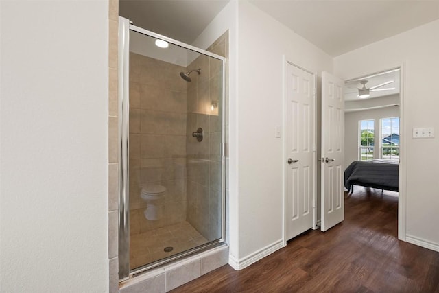 104 Live Oak Cir, Bertram, TX 78605 - full bath featuring a stall shower, wood finished floors, and connected bathroom