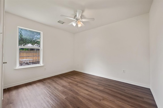 104 Live Oak Cir, Bertram, TX 78605 - empty room featuring dark wood finished floors and a ceiling fan