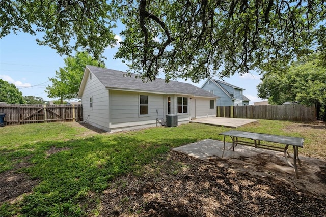 104 Live Oak Cir, Bertram, TX 78605 - rear view of house with a patio and a fenced backyard