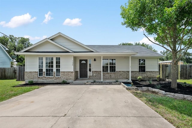 104 Live Oak Cir, Bertram, TX 78605 - view of front of property with brick siding and a porch