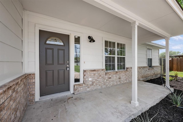104 Live Oak Cir, Bertram, TX 78605 - doorway to property with a porch and brick siding