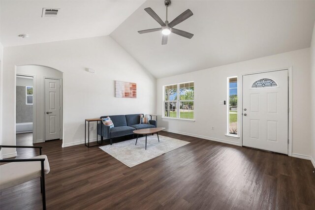 104 Live Oak Cir, Bertram, TX 78605 - living room with a ceiling fan, arched walkways, dark wood-type flooring, and high vaulted ceiling