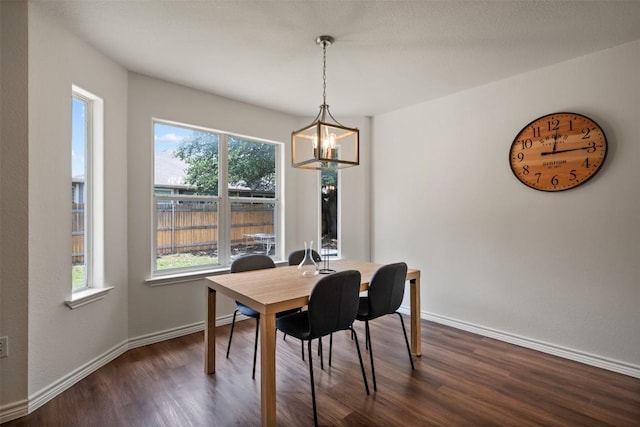 104 Live Oak Cir, Bertram, TX 78605 - dining space with a chandelier and dark wood finished floors