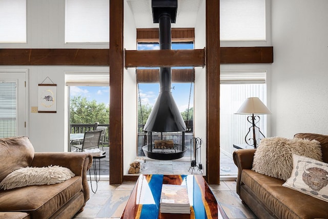 229 Comanche Ln, Point Venture, TX 78645 - living area with a towering ceiling and a wood stove