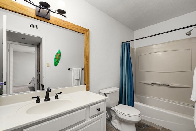 229 Comanche Ln, Point Venture, TX 78645 - bathroom with vanity, shower / bath combo, and a textured ceiling