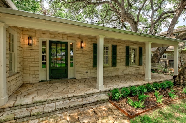2908 Glenview Ave, Austin, TX 78703 - doorway to property featuring a porch and stone siding