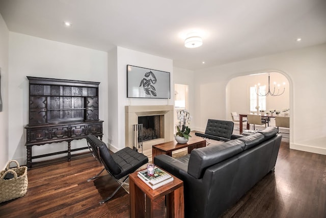 2908 Glenview Ave, Austin, TX 78703 - living area featuring arched walkways, a chandelier, dark wood finished floors, a fireplace, and recessed lighting