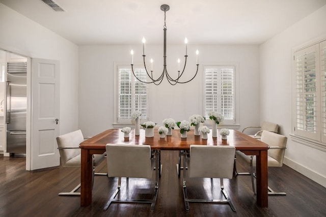 2908 Glenview Ave, Austin, TX 78703 - dining room featuring a chandelier, dark wood-style floors, and healthy amount of natural light