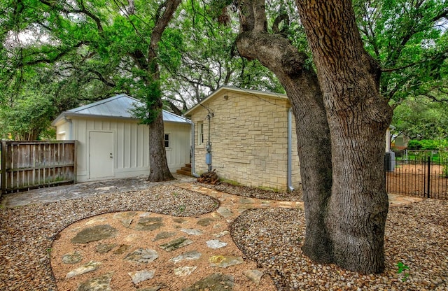 2908 Glenview Ave, Austin, TX 78703 - rear view of property with a shed and stone siding