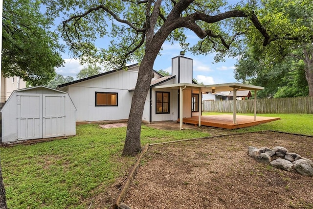 12416 Cassady Dr, Austin, TX 78727 - back of house featuring a storage shed, a chimney, and a wooden deck
